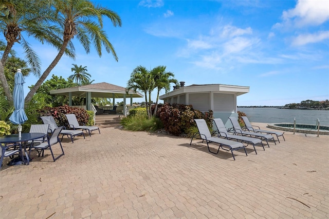 9425 Blind Pass Rd Unit 1008, St Pete Beach, FL 33706 - view of patio with a gazebo and a water view