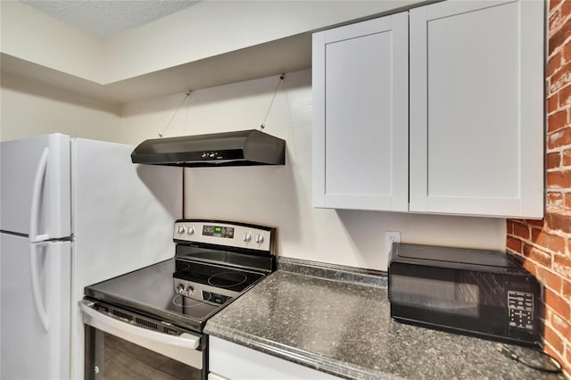 125 Picardy Villa Cir Unit 100, Brandon, FL 33510 - kitchen with electric stove, ventilation hood, white cabinetry, brick wall, and black microwave