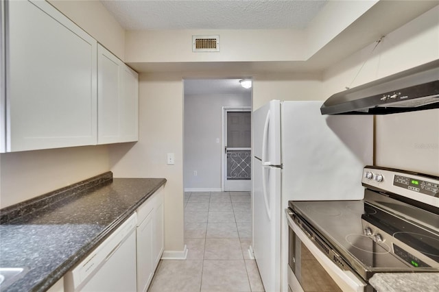 125 Picardy Villa Cir Unit 100, Brandon, FL 33510 - kitchen featuring white appliances, white cabinetry, light tile patterned floors, wall chimney range hood, and a textured ceiling