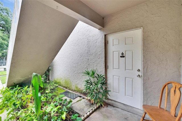 125 Picardy Villa Cir Unit 100, Brandon, FL 33510 - view of exterior entry with stucco siding