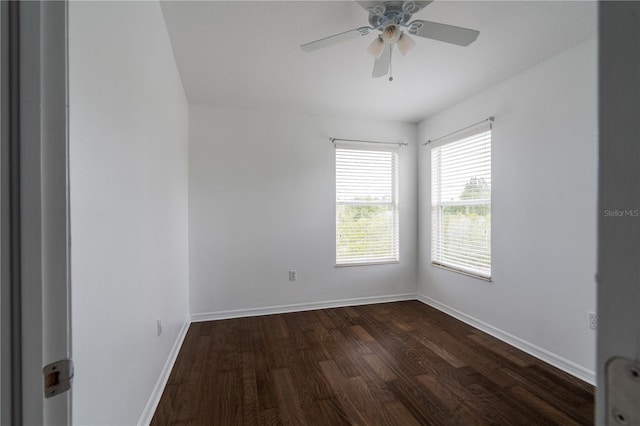 6940 47th Way N, Pinellas Park, FL 33781 - unfurnished room featuring dark wood-style flooring, baseboards, and a ceiling fan