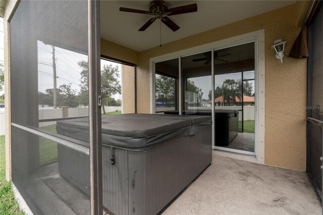 6940 47th Way N, Pinellas Park, FL 33781 - sunroom with a jacuzzi, ceiling fan, and plenty of natural light