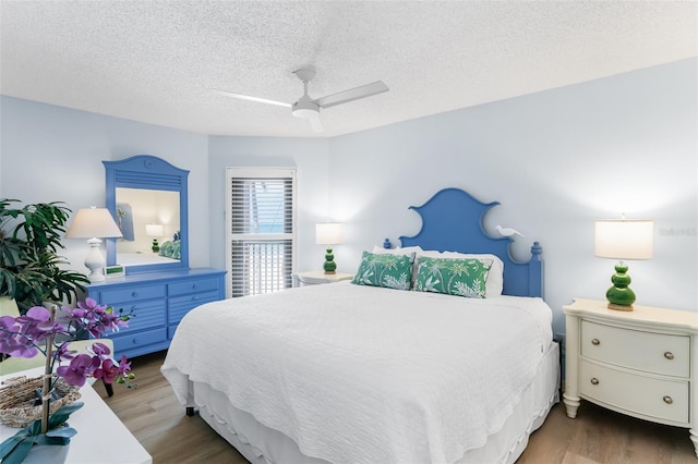 17334 Gulf Blvd Unit 203, North Redington Beach, FL 33708 - bedroom featuring wood finished floors, ceiling fan, and a textured ceiling