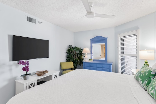 17334 Gulf Blvd Unit 203, North Redington Beach, FL 33708 - bedroom featuring a textured ceiling and a ceiling fan