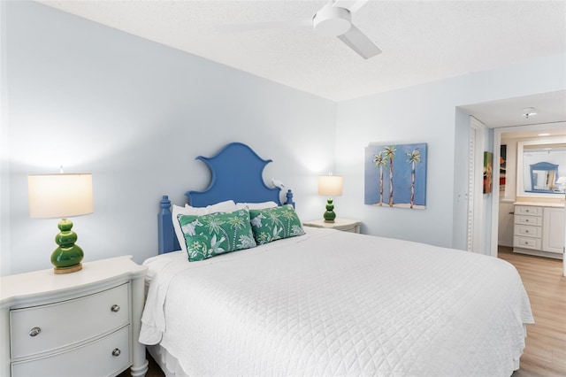 17334 Gulf Blvd Unit 203, North Redington Beach, FL 33708 - bedroom with light wood finished floors and a ceiling fan