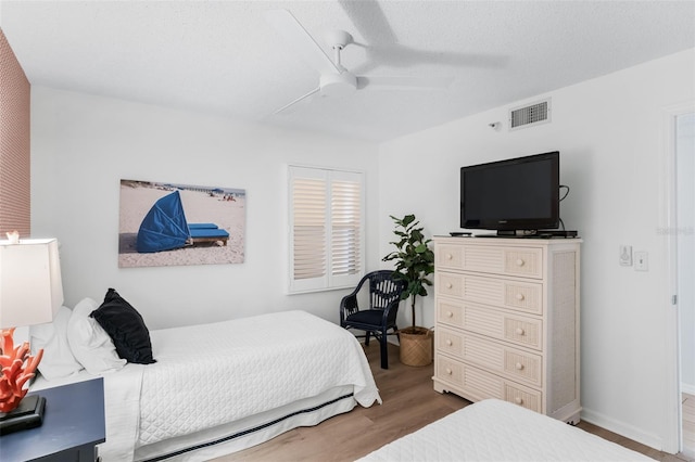 17334 Gulf Blvd Unit 203, North Redington Beach, FL 33708 - bedroom with wood finished floors and ceiling fan