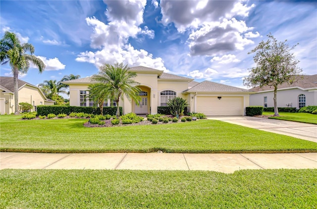 4304 Place Le Manes, Lutz, FL 33558 - mediterranean / spanish-style house featuring a garage, driveway, stucco siding, and a front lawn