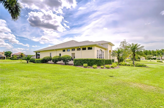 4304 Place Le Manes, Lutz, FL 33558 - view of side of home with a lawn and stucco siding