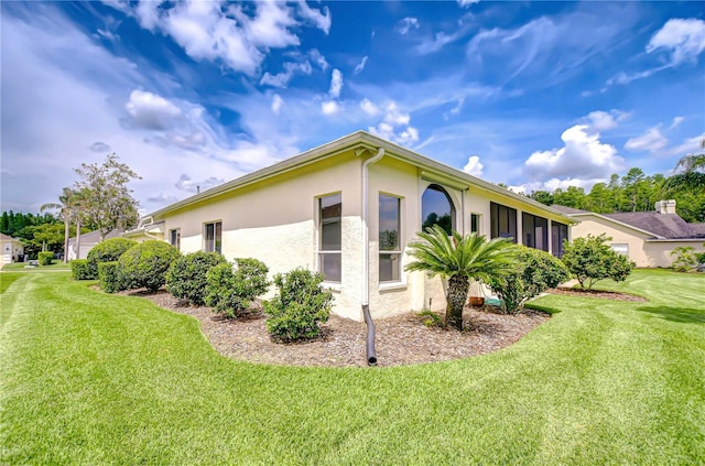 4304 Place Le Manes, Lutz, FL 33558 - view of side of home featuring stucco siding and a lawn