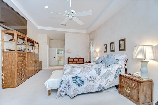 4304 Place Le Manes, Lutz, FL 33558 - bedroom with carpet, a tray ceiling, and a ceiling fan