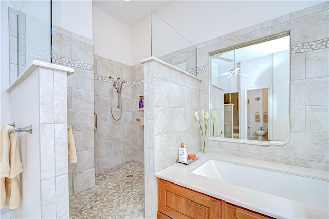 4304 Place Le Manes, Lutz, FL 33558 - bathroom featuring tile walls, ceiling fan, walk in shower, and vanity