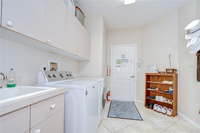 4304 Place Le Manes, Lutz, FL 33558 - laundry room featuring separate washer and dryer, cabinet space, light tile patterned floors, and baseboards