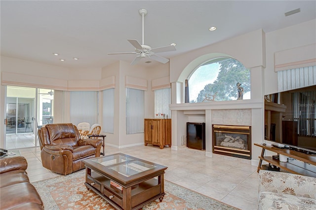 4304 Place Le Manes, Lutz, FL 33558 - tiled living area featuring ceiling fan, a tiled fireplace, and recessed lighting