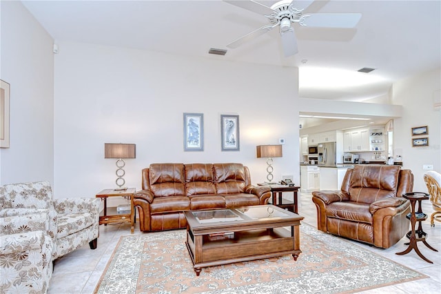 4304 Place Le Manes, Lutz, FL 33558 - living room with ceiling fan and light tile patterned floors