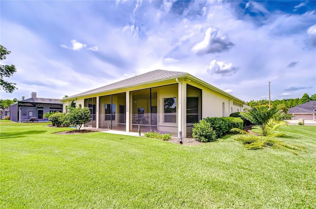 4304 Place Le Manes, Lutz, FL 33558 - rear view of house featuring a yard, a sunroom, and stucco siding