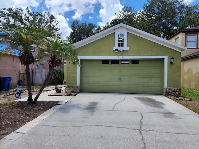 8313 Arabian Dunes Pl, Riverview, FL 33578 - garage with concrete driveway