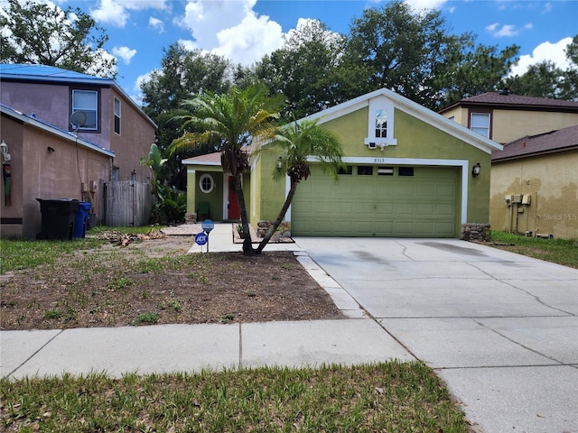 8313 Arabian Dunes Pl, Riverview, FL 33578 - view of front facade featuring concrete driveway, an attached garage, and stucco siding