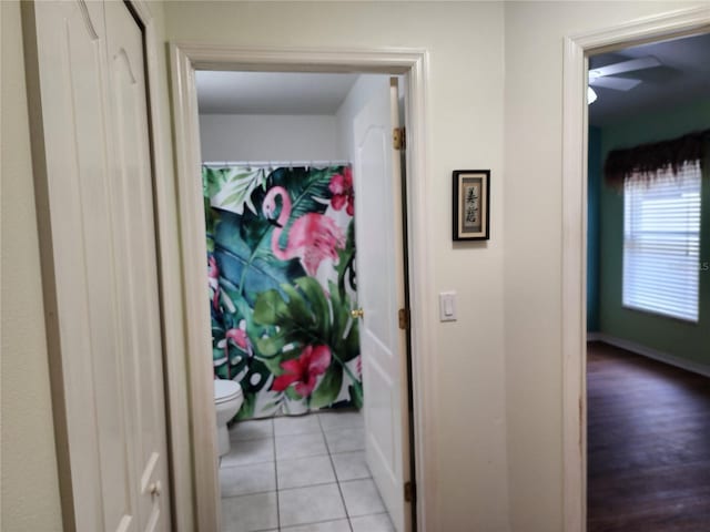 8313 Arabian Dunes Pl, Riverview, FL 33578 - hallway with light tile patterned floors and baseboards