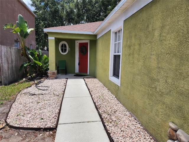 8313 Arabian Dunes Pl, Riverview, FL 33578 - property entrance featuring stucco siding and a shingled roof