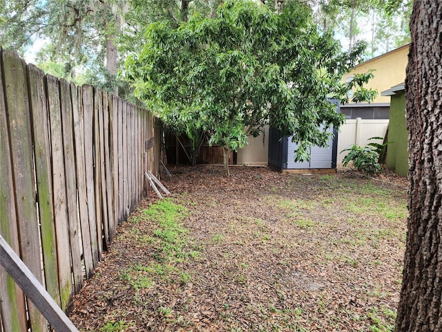 8313 Arabian Dunes Pl, Riverview, FL 33578 - fenced backyard with a storage unit