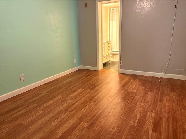4020 55th St N Unit 1106, Kenneth City, FL 33709 - spare room featuring wood finished floors and baseboards