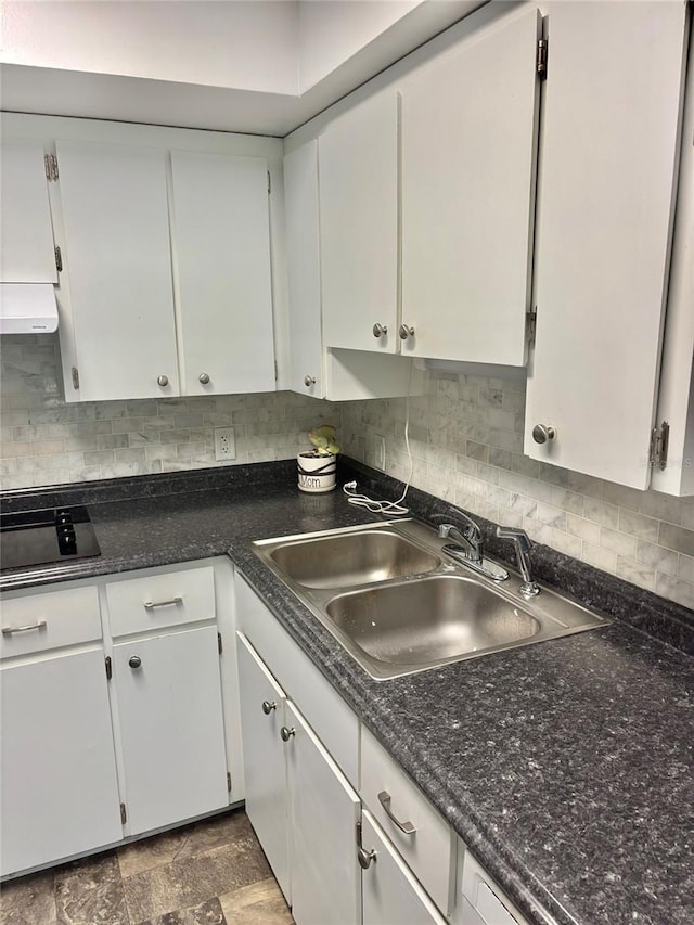4020 55th St N Unit 1106, Kenneth City, FL 33709 - kitchen featuring ventilation hood, a sink, black electric cooktop, decorative backsplash, and white cabinets