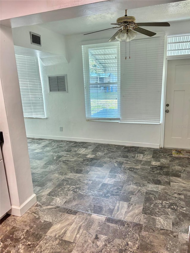 4020 55th St N Unit 1106, Kenneth City, FL 33709 - spare room featuring baseboards and ceiling fan