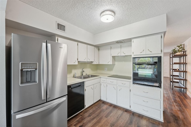 2461 Rhodesian Dr Unit 47, Clearwater, FL 33763 - kitchen featuring black appliances, a sink, dark wood-type flooring, a textured ceiling, and light countertops