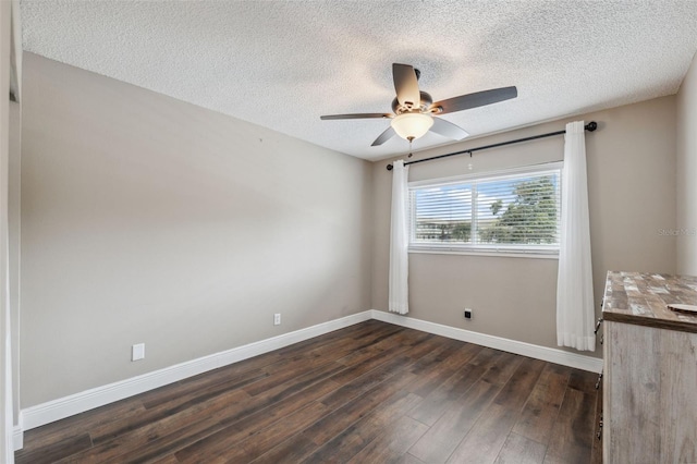 2461 Rhodesian Dr Unit 47, Clearwater, FL 33763 - empty room with ceiling fan, dark wood-type flooring, a textured ceiling, and baseboards