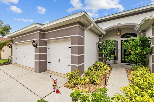 4505 Anaconda Dr, New Port Richey, FL 34655 - view of property exterior with stucco siding, driveway, and an attached garage