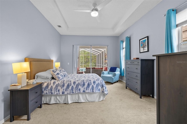 4505 Anaconda Dr, New Port Richey, FL 34655 - bedroom with light colored carpet, access to exterior, a raised ceiling, a ceiling fan, and baseboards