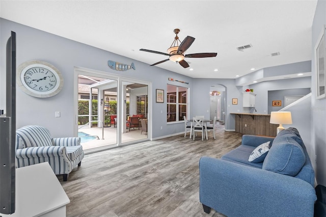 4505 Anaconda Dr, New Port Richey, FL 34655 - living room with wood finished floors, a ceiling fan, recessed lighting, and baseboards