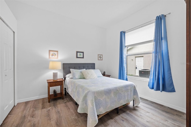 4505 Anaconda Dr, New Port Richey, FL 34655 - bedroom featuring wood finished floors, baseboards, and a closet