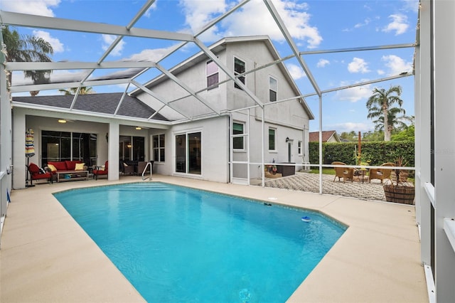 4505 Anaconda Dr, New Port Richey, FL 34655 - swimming pool featuring outdoor lounge area, a patio, and glass enclosure