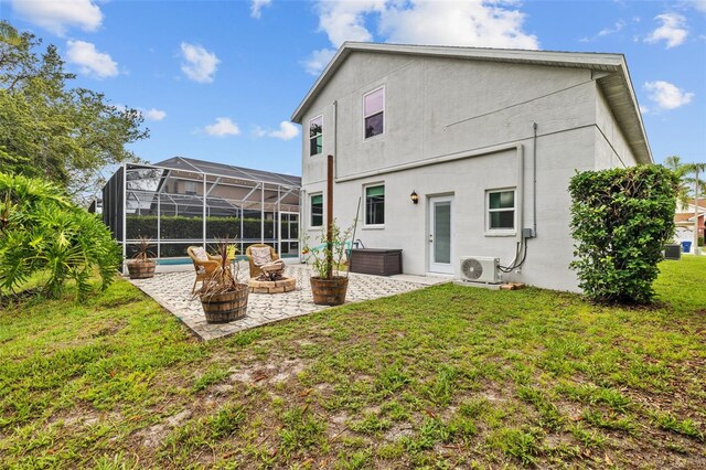 4505 Anaconda Dr, New Port Richey, FL 34655 - back of house featuring a patio area, a lawn, glass enclosure, a cooling unit, and stucco siding