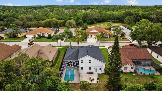 4505 Anaconda Dr, New Port Richey, FL 34655 - aerial view of residential area featuring a heavily wooded area and a pool