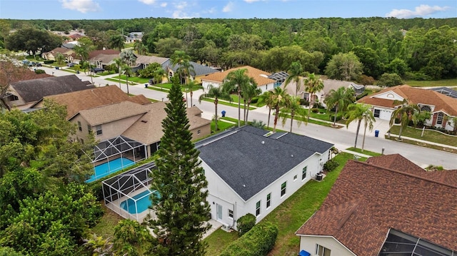4505 Anaconda Dr, New Port Richey, FL 34655 - aerial perspective of suburban area with a pool area and a forest