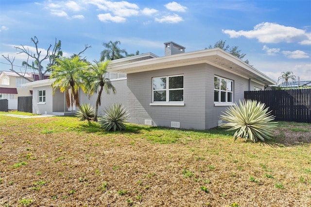 837 E Edgewood Dr, Lakeland, FL 33803 - view of side of property with crawl space and brick siding