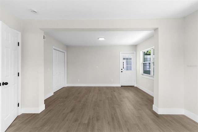 837 E Edgewood Dr, Lakeland, FL 33803 - spare room with wood finished floors, baseboards, and a smoke detector