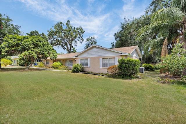 321 Belle View Ave, Temple Terrace, FL 33617 - view of front of property with a front yard and central air condition unit