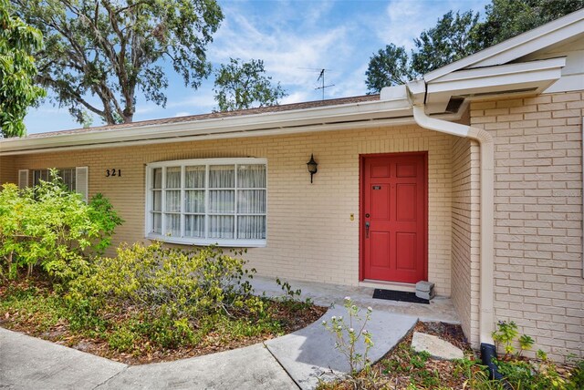 321 Belle View Ave, Temple Terrace, FL 33617 - doorway to property featuring brick siding