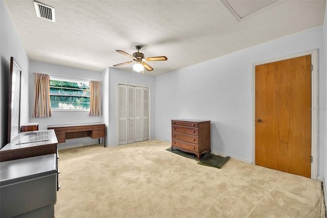 321 Belle View Ave, Temple Terrace, FL 33617 - unfurnished bedroom featuring a closet, carpet, a ceiling fan, and a textured ceiling