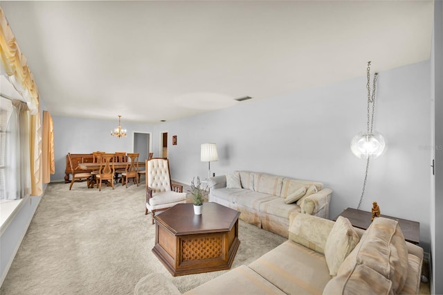 321 Belle View Ave, Temple Terrace, FL 33617 - living room featuring a chandelier and light colored carpet