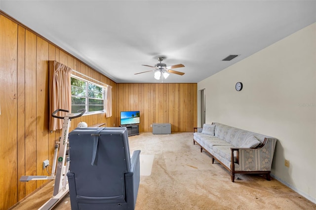 321 Belle View Ave, Temple Terrace, FL 33617 - workout area featuring ceiling fan, wood walls, and light carpet