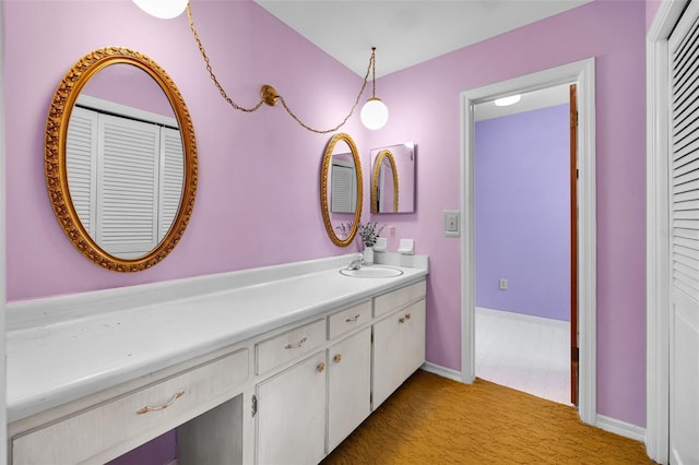 321 Belle View Ave, Temple Terrace, FL 33617 - bathroom featuring vanity, a closet, and baseboards
