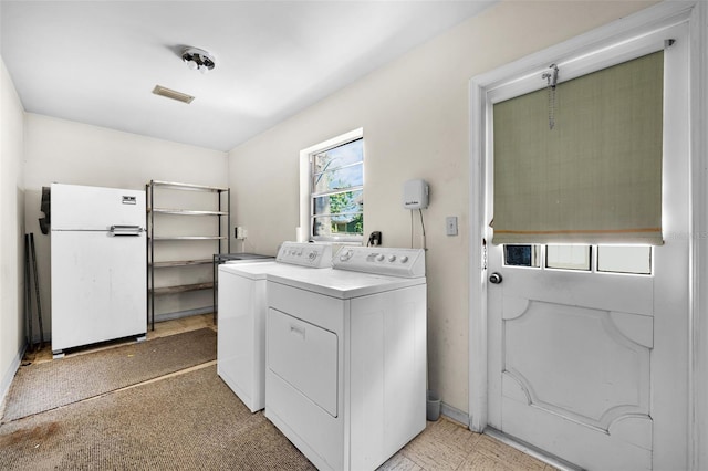 321 Belle View Ave, Temple Terrace, FL 33617 - washroom featuring washer and clothes dryer and baseboards