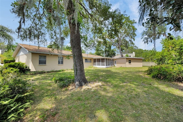 321 Belle View Ave, Temple Terrace, FL 33617 - view of green lawn with a sunroom