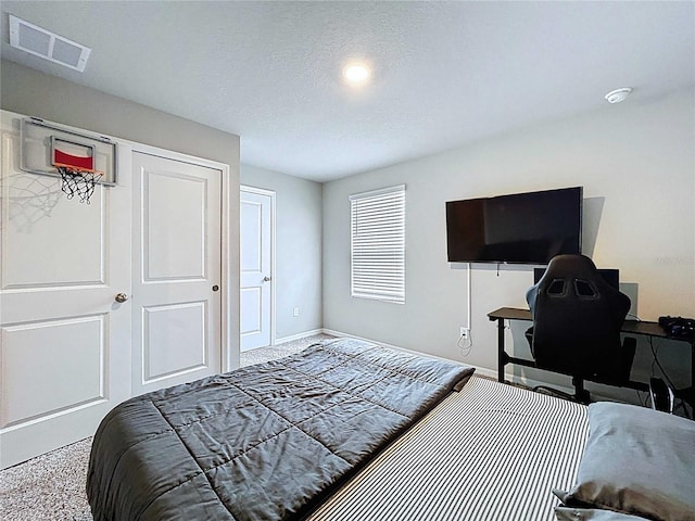 32451 Limitless Pl, Wesley Chapel, FL 33545 - carpeted bedroom with baseboards and a textured ceiling