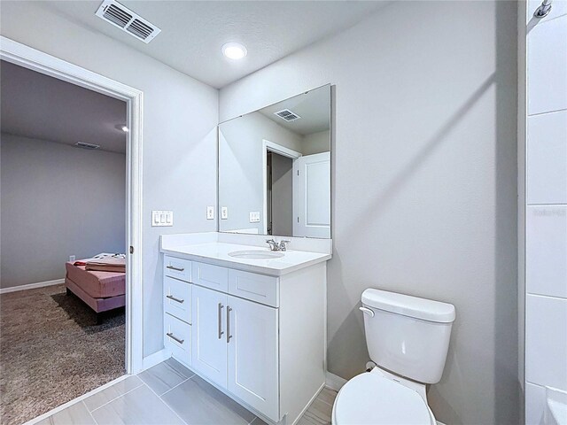 32451 Limitless Pl, Wesley Chapel, FL 33545 - bathroom featuring vanity, toilet, and baseboards