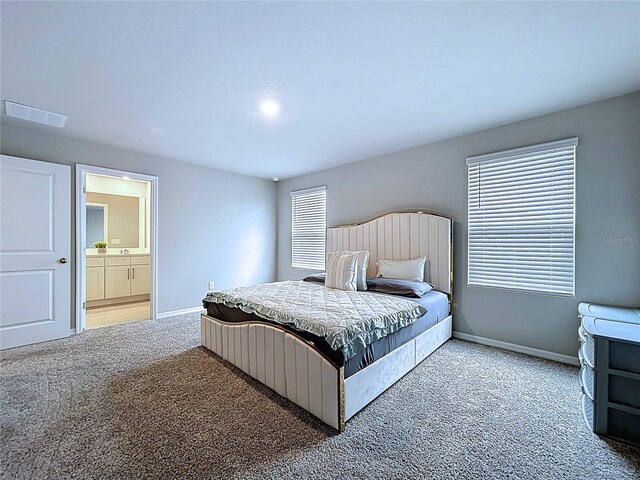 32451 Limitless Pl, Wesley Chapel, FL 33545 - bedroom with carpet, baseboards, and connected bathroom